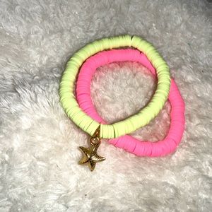 2 vibrant clay bracelets with a gold sea star